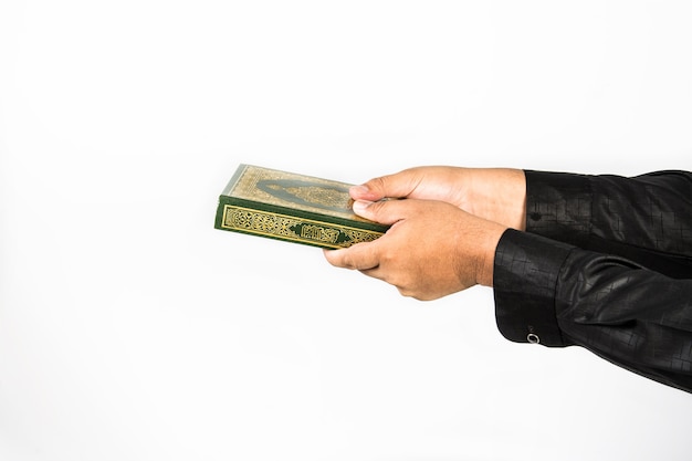 Koran in hand - holy book of Muslims (public item of all muslims) Koran in hand 