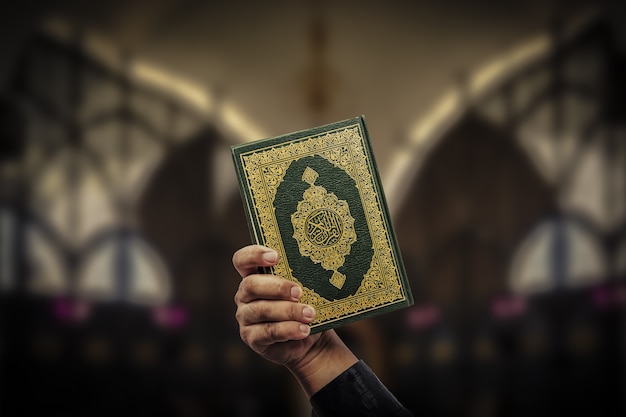 Koran in hand - holy book of Muslims