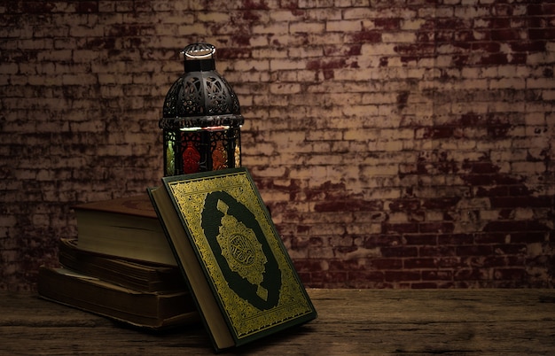 Koran - holy book of Muslims ( public item of all muslims ) on the table , still life 