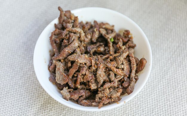 Korean beef in a bowl with a spoon