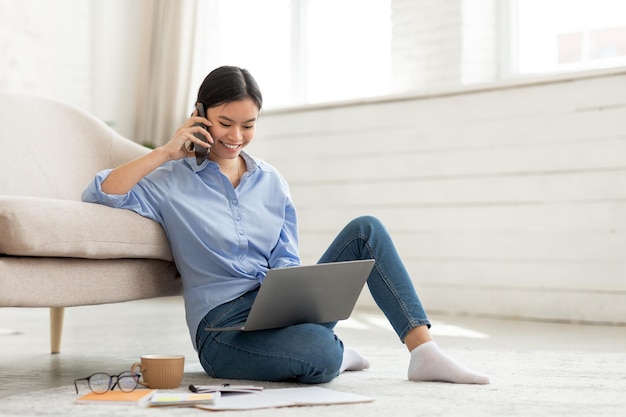 Korean business woman working from home having phone call