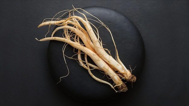 Korean fresh ginseng on black stone