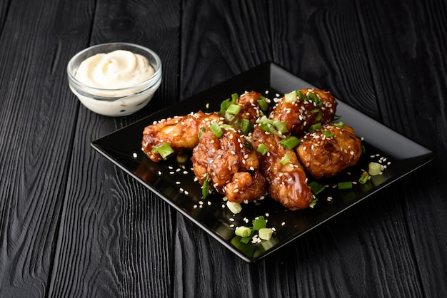 Korean fried chicken with black backdrop