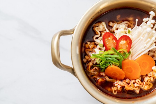 korean instant noodles in golden pot