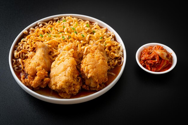 Korean instant noodles with fried chicken or Fried chicken ramyeon - Korean food style