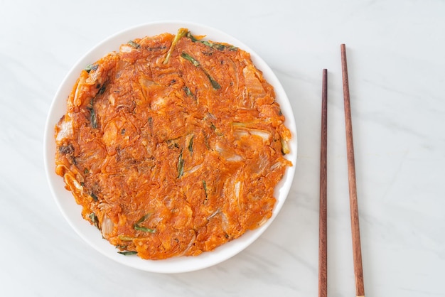 Korean Kimchi pancake or Kimchijeon - Fried Mixed Egg, Kimchi, and Flour - Korean food style