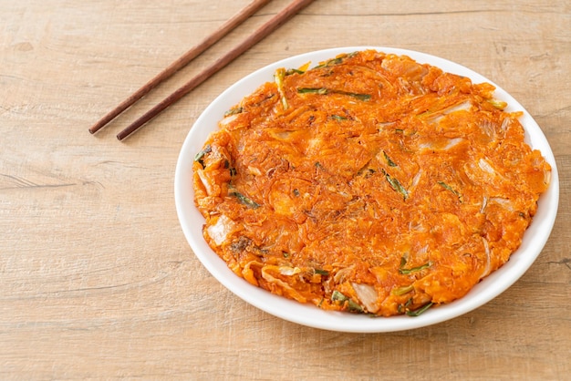 Korean Kimchi pancake or Kimchijeon - Fried Mixed Egg, Kimchi, and Flour - Korean food style