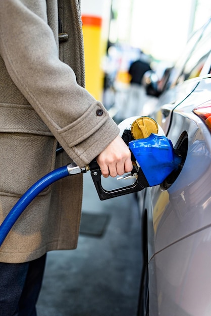 Korean Man Gasing at a Gas Station