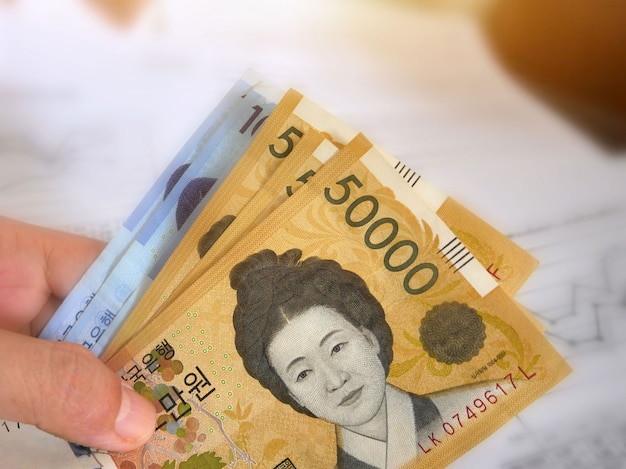 Photo korean money on finance account background.