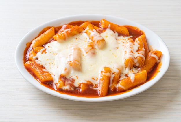 Korean rice cake in spicy Korean sauce with cheese, Cheese Tokpokki, Tteokbokki with Cheese. Korean food style