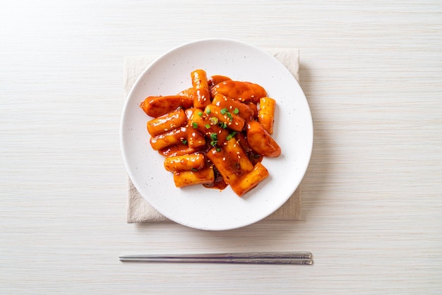 Korean rice cake stick with sausage in spicy sauce Tteokbokki