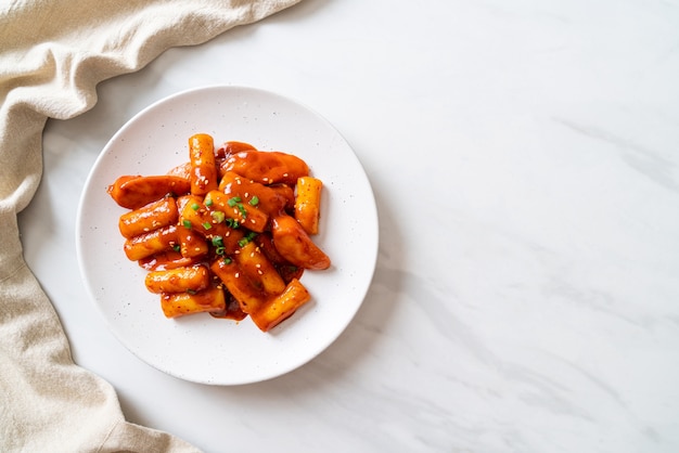 Korean rice cake sticks in spicy sauce (Tteokbokki)