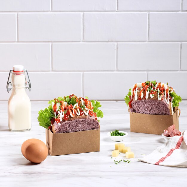 Korean Sandwich Purple Bread (Egg Drop) with Egg, Lettuce, Mayonaise, Cheese, Parsley, Sauce. Served with Milk. White Background Concept for Bakery or Advertisement