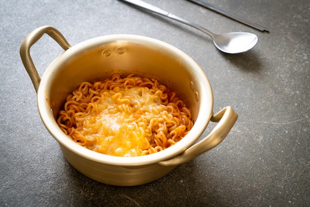 Korean spicy instant noodle bowl with mozzarella cheese