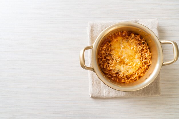 Korean spicy instant noodle bowl with mozzarella cheese