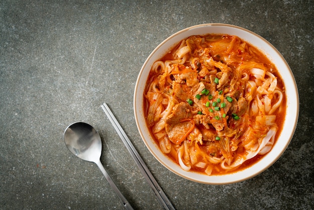 Korean udon ramen noodles with pork in kimchi soup - Asian food style