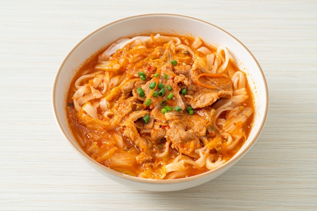 Korean udon ramen noodles with pork in kimchi soup - Asian food style