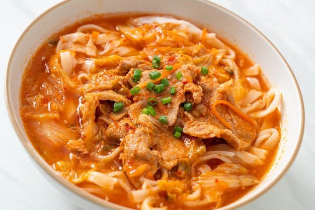 Korean udon ramen noodles with pork in kimchi soup - Asian food style