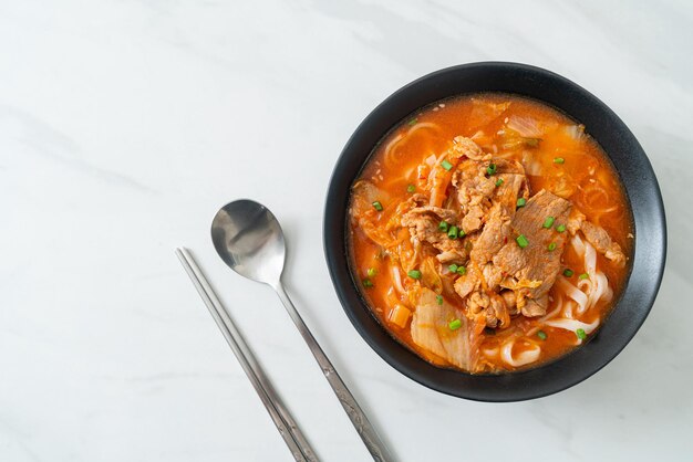 Korean udon ramen noodles with pork in kimchi soup - Asian food style