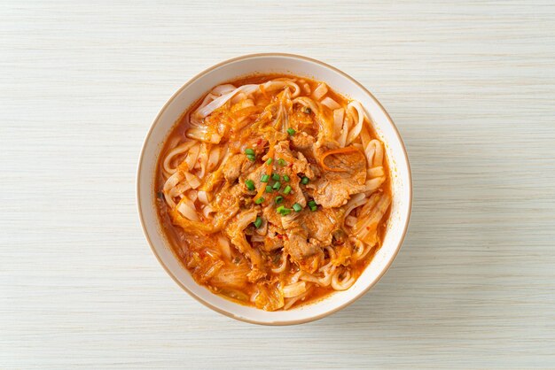 Korean udon ramen noodles with pork in kimchi soup - Asian food style