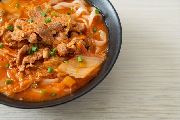 Korean udon ramen noodles with pork in kimchi soup - Asian food style