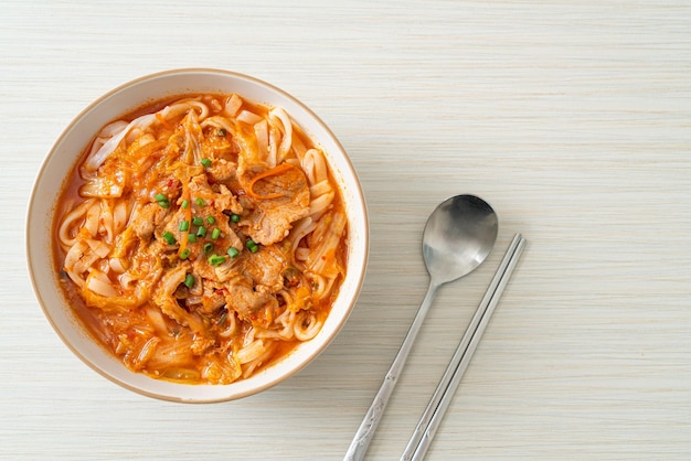 Korean udon ramen noodles with pork in kimchi soup - Asian food style