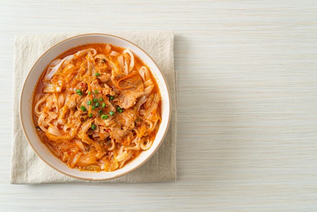 Korean udon ramen noodles with pork in kimchi soup - Asian food style