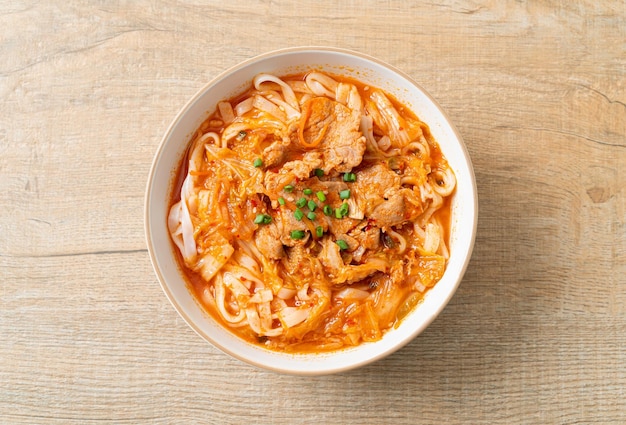 Korean udon ramen noodles with pork in kimchi soup