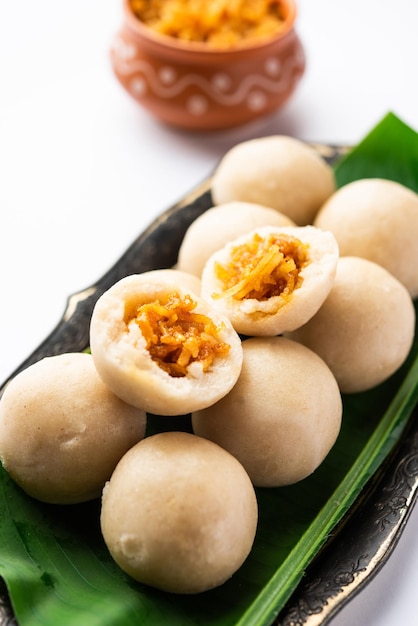 Photo kozhukatta or kolukattai pidi is steamed dumplings made with rice flour filling coconut jaggery