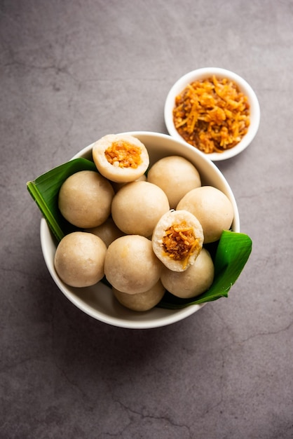 Photo kozhukatta or kolukattai pidi is steamed dumplings made with rice flour filling coconut jaggery