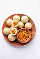 Photo kozhukatta or kolukattai pidi is steamed dumplings made with rice flour filling coconut jaggery