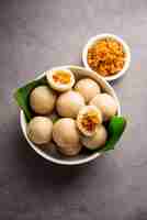 Photo kozhukatta or kolukattai pidi is steamed dumplings made with rice flour filling coconut jaggery