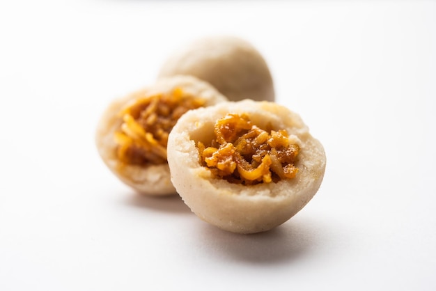 Photo kozhukatta or kolukattai pidi is steamed dumplings made with rice flour filling coconut jaggery