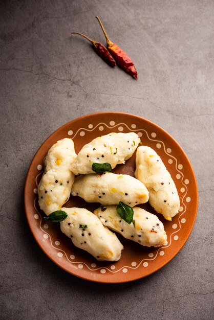 Photo kozhukatta pidi is a steamed snack food from kerala rice flour with finger impressions