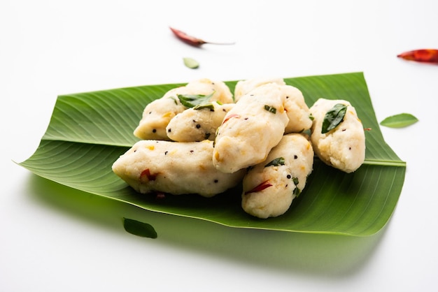 Photo kozhukatta pidi is a steamed snack food from kerala rice flour with finger impressions