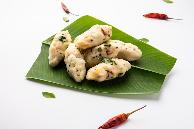 Photo kozhukatta pidi is a steamed snack food from kerala rice flour with finger impressions