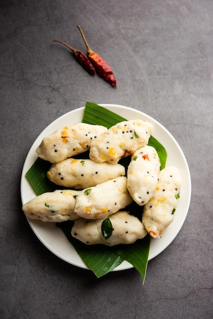 Photo kozhukatta pidi is a steamed snack food from kerala rice flour with finger impressions