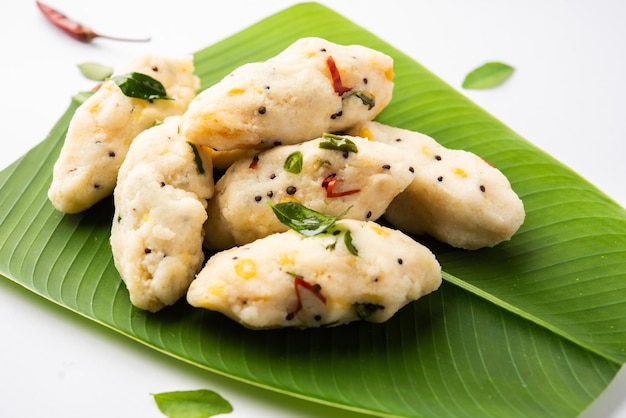 Photo kozhukatta pidi is a steamed snack food from kerala rice flour with finger impressions