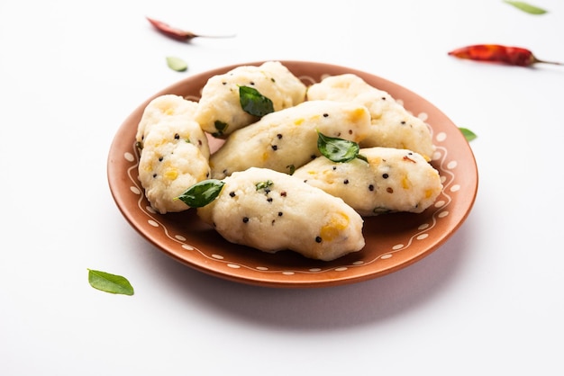 Photo kozhukatta pidi is a steamed snack food from kerala rice flour with finger impressions