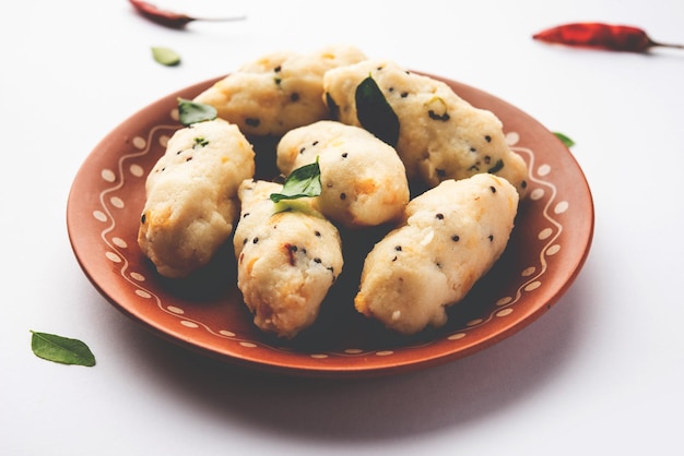 Photo kozhukatta pidi is a steamed snack food from kerala rice flour with finger impressions