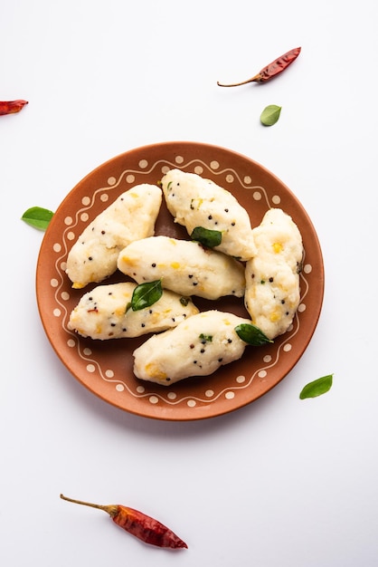 Photo kozhukatta pidi is a steamed snack food from kerala rice flour with finger impressions