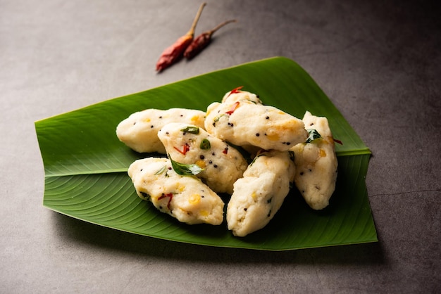 Photo kozhukatta pidi is a steamed snack food from kerala rice flour with finger impressions