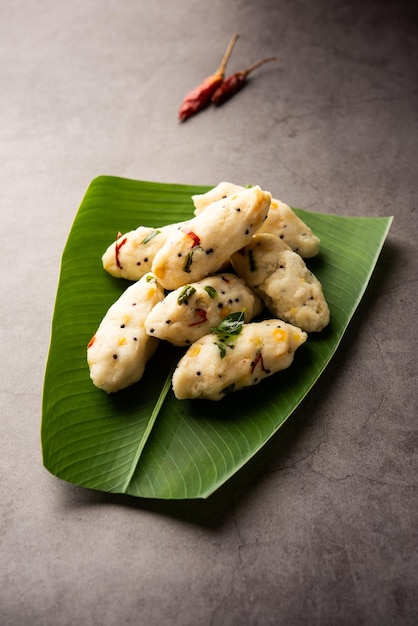 Photo kozhukatta pidi is a steamed snack food from kerala rice flour with finger impressions