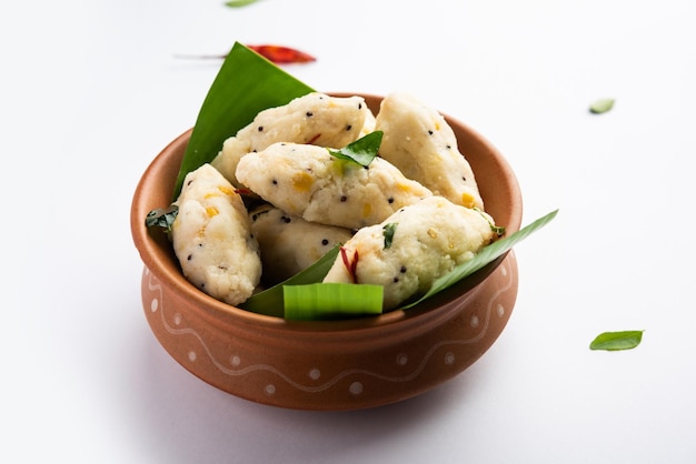 Photo kozhukatta pidi is a steamed snack food from kerala rice flour with finger impressions