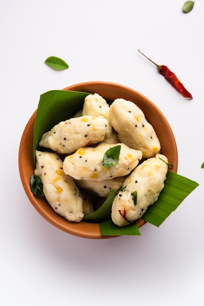 Photo kozhukatta pidi is a steamed snack food from kerala rice flour with finger impressions