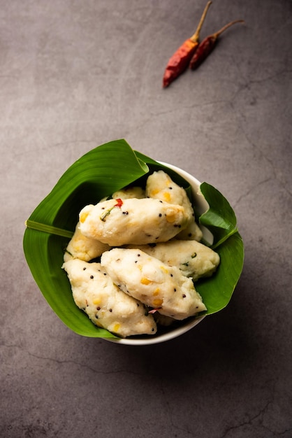 Photo kozhukatta pidi is a steamed snack food from kerala rice flour with finger impressions