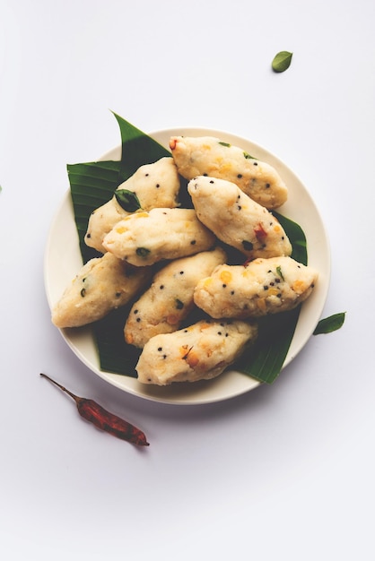 Photo kozhukatta pidi is a steamed snack food from kerala rice flour with finger impressions