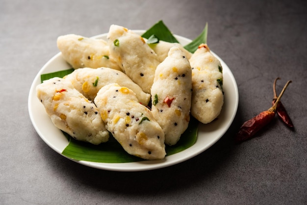 Photo kozhukatta pidi is a steamed snack food from kerala rice flour with finger impressions