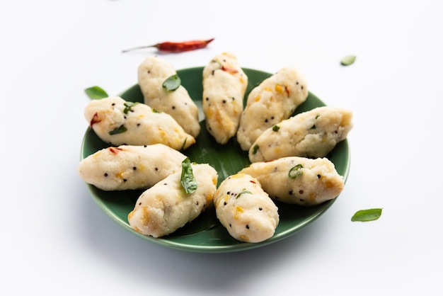 Photo kozhukatta pidi is a steamed snack food from kerala rice flour with finger impressions