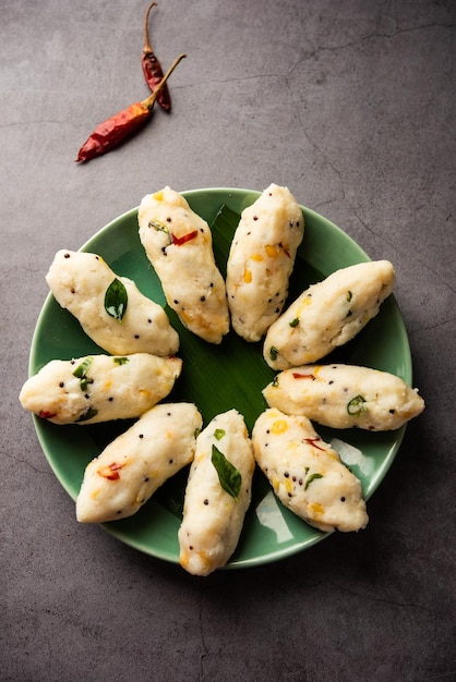 Photo kozhukatta pidi is a steamed snack food from kerala rice flour with finger impressions